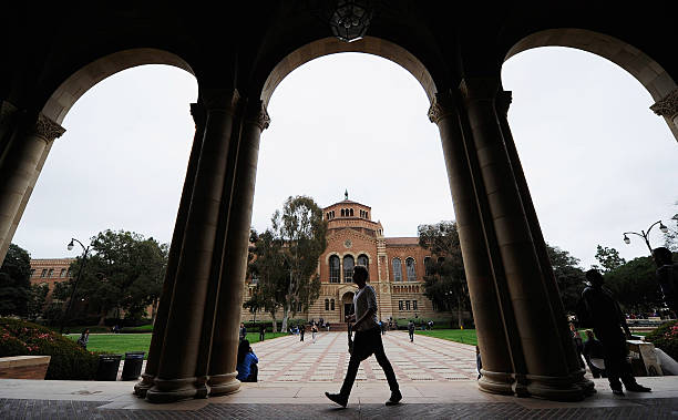 LOS ANGELES, CA - APRIL 23:  A student walks near Royce Hall on the campus of UCLA on April 23, 2012 in Los Angeles, California. According to reports, half of recent college graduates with bachelors degrees are finding themselves underemployed or jobless.  (Photo by Kevork Djansezian/Getty Images)