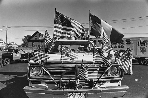 A car adorned with American and Italian flags at the Columbus Day Parade in Medford, Massachusetts, USA, 9th October 1978. (Photo by Barbara Alper/Getty Images)