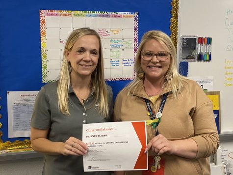 Dover Area High School teacher Britney Marsh receives a $250.00 grant to help her students learn more about genetic engineering and tissue cultures.