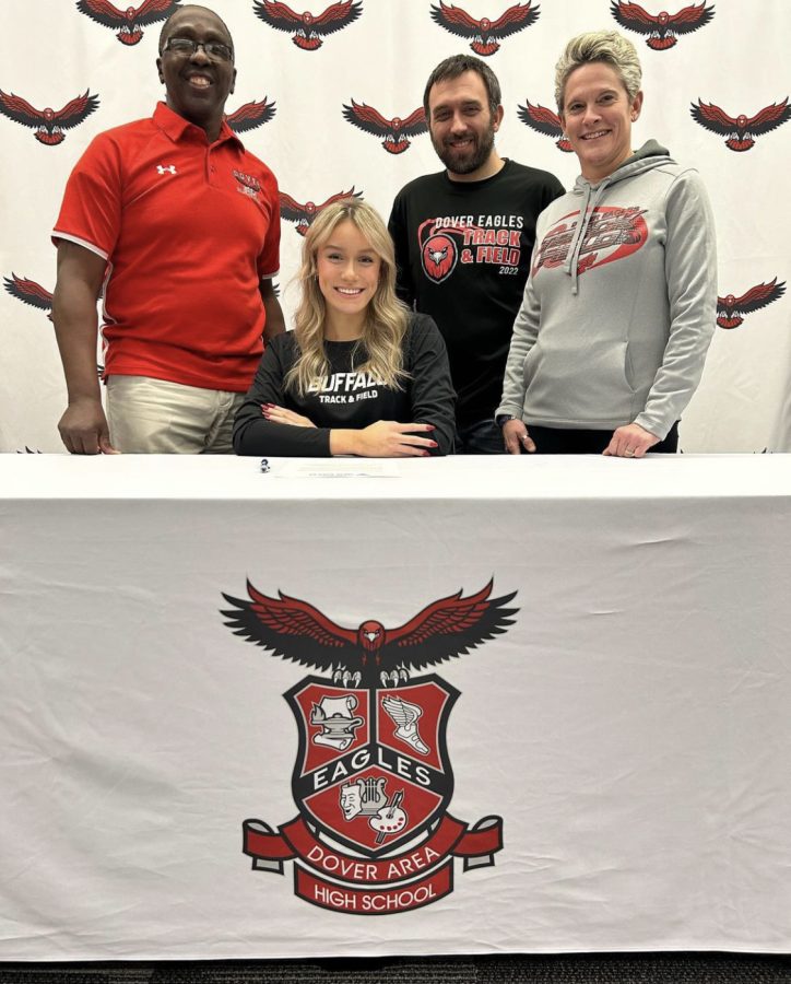 Gemma Galligani signs her National Letter of Intent to continue her track and field career at The University of Buffalo. Alongside her are coaches of the teams she took part in at Dover.