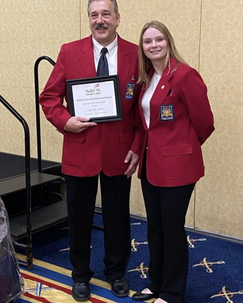 Tim Smith with SkillsUSA State Officer and Senior Lexi Wells.
