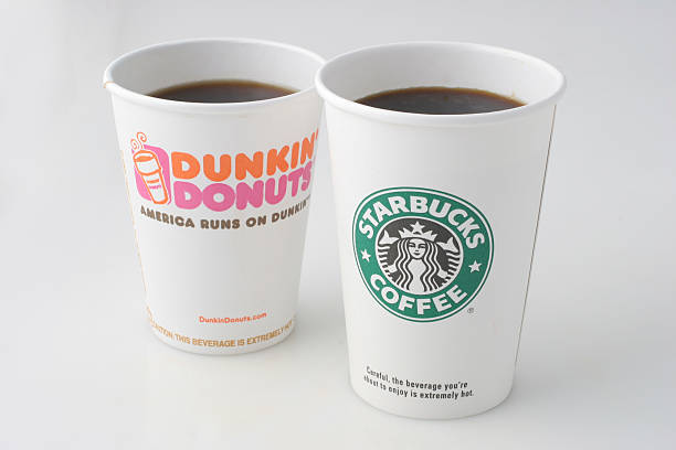 WASHINGTON, DC - SEPTEMBER 06: Dunkin Donuts and Starbucks coffee cups. Photographed in the Washington Post Studio on September 6, 2006, in Washington, DC. (Photo by Julia Ewan/The Washington Post via Getty Images)